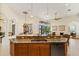 Well-equipped kitchen featuring granite countertops and wood cabinetry at 7167 Whitemarsh Cir, Lakewood Ranch, FL 34202