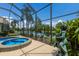 Hot tub and view of beautiful lake from a screened-in pool area at 7167 Whitemarsh Cir, Lakewood Ranch, FL 34202