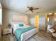 Bedroom with king-size bed, wood flooring, and en-suite bathroom at 2687 Golf Course Dr # 219, Sarasota, FL 34234