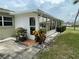 Private condo patio with sliding glass doors at 2687 Golf Course Dr # 219, Sarasota, FL 34234