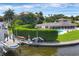 Waterfront home with private dock and lush landscaping at 1701 Sandalwood Dr, Sarasota, FL 34231