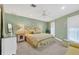 Charming bedroom with soft color palette and ample natural light at 1701 Sandalwood Dr, Sarasota, FL 34231