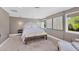 Serene bedroom with soft grey walls and plenty of natural light at 1701 Sandalwood Dr, Sarasota, FL 34231