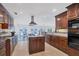 Large kitchen with island, granite countertops, and water views at 1701 Sandalwood Dr, Sarasota, FL 34231