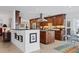 Modern kitchen featuring dark wood cabinets, granite countertops, and stainless steel appliances at 1701 Sandalwood Dr, Sarasota, FL 34231