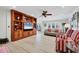 Bright living room featuring built-in shelving and hardwood floors at 1701 Sandalwood Dr, Sarasota, FL 34231