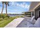 Waterfront patio with comfortable seating at 1701 Sandalwood Dr, Sarasota, FL 34231