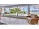 Spacious screened porch with tile floor and water views at 1701 Sandalwood Dr, Sarasota, FL 34231