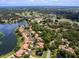 Community aerial view, showcasing a lake and golf course at 7360 Oak Moss Dr # 4, Sarasota, FL 34241