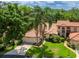 Aerial view of home showcasing tile roof and lush landscaping at 7360 Oak Moss Dr # 4, Sarasota, FL 34241