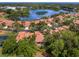 Aerial view of a beautiful home situated near a tranquil lake at 7360 Oak Moss Dr # 4, Sarasota, FL 34241