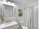 Updated bathroom with white subway tile and quartz vanity at 7360 Oak Moss Dr # 4, Sarasota, FL 34241