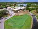 Aerial view of clubhouse near golf course at 7360 Oak Moss Dr # 4, Sarasota, FL 34241