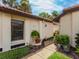 Inviting entryway with lush landscaping and a peaceful fountain at 7360 Oak Moss Dr # 4, Sarasota, FL 34241