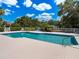 Refreshing community pool with lounge chairs at 7758 Us Open Loop, Lakewood Ranch, FL 34202