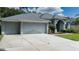 Two-car garage and front entrance at 2120 Golf Manor Blvd, Valrico, FL 33594