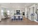 Spacious kitchen with stainless steel appliances, an island with seating, and stylish blue backsplash at 2605 Waterfront Cir, Sarasota, FL 34240