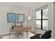 Cozy office space with a modern desk setup and a large window providing natural light at 2625 Waterfront Cir, Sarasota, FL 34240