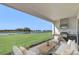 Enjoy outdoor living on this patio with a full kitchen, grill, and serene water views at 2625 Waterfront Cir, Sarasota, FL 34240