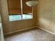 Bright dining area featuring tile floors, a window with blinds and warm neutral walls at 2910 122Nd E Ter, Parrish, FL 34219