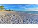 Gorgeous beach with expansive sand and gentle waves, perfect for relaxation and enjoying the coastal scenery at 3607 E Bay Dr # 202, Holmes Beach, FL 34217