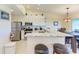 Modern kitchen featuring granite countertops, stainless steel appliances, and a convenient breakfast bar with seating at 3607 E Bay Dr # 202, Holmes Beach, FL 34217
