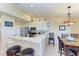 Charming kitchen boasts granite counters, stainless appliances, a breakfast bar, and an adjacent dining area at 3607 E Bay Dr # 202, Holmes Beach, FL 34217