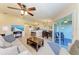 Well-lit living space with a view to a full kitchen and outdoor balcony at 3607 E Bay Dr # 202, Holmes Beach, FL 34217