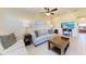 Bright living area with tile flooring, cozy sofas, and a flat-screen TV at 3607 E Bay Dr # 202, Holmes Beach, FL 34217