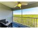Screened-in patio featuring view of nature, a ceiling fan, and comfortable seating at 3607 E Bay Dr # 202, Holmes Beach, FL 34217
