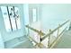 Bright stairwell with natural light and safety railing; modern design at 2226 Grove St, Sarasota, FL 34239