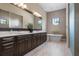 Spa-like bathroom featuring double vanity and large soaking tub at 8480 Lindrick Ln, Lakewood Ranch, FL 34202