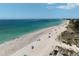 Beachfront property with people enjoying the beach and ocean at 4805 2Nd Ave, Holmes Beach, FL 34217