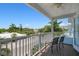 Private balcony with chairs and neighborhood view at 4805 2Nd Ave, Holmes Beach, FL 34217