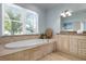 Relaxing bathroom featuring a large soaking tub and tile surround at 4805 2Nd Ave, Holmes Beach, FL 34217