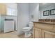 Convenient bathroom with toilet and vanity, near the laundry room at 4805 2Nd Ave, Holmes Beach, FL 34217