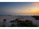 Beach scene at sunset with sand art and peaceful message at 4805 2Nd Ave, Holmes Beach, FL 34217