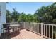 Private deck with table and chairs, offering tranquil views at 4805 2Nd Ave, Holmes Beach, FL 34217