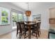 Bright dining room with table and chairs, near kitchen at 4805 2Nd Ave, Holmes Beach, FL 34217