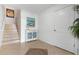 Entryway with staircase and decorative cabinet at 4805 2Nd Ave, Holmes Beach, FL 34217