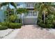 Front view of a charming two-story light blue house at 4805 2Nd Ave, Holmes Beach, FL 34217