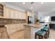 Kitchen with granite countertops, stainless steel appliances, and light wood cabinets at 4805 2Nd Ave, Holmes Beach, FL 34217