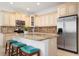 Spacious kitchen with granite island, stainless steel appliances, and light cabinets at 4805 2Nd Ave, Holmes Beach, FL 34217