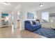 Cozy living area with a blue couch and area rug at 4805 2Nd Ave, Holmes Beach, FL 34217