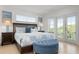 Spacious main bedroom with king-size bed and private balcony access at 4805 2Nd Ave, Holmes Beach, FL 34217