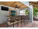 Covered outdoor bar with seating, perfect for entertaining at 4805 2Nd Ave, Holmes Beach, FL 34217