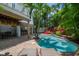 Inviting pool with patio, outdoor bar, and lush landscaping at 4805 2Nd Ave, Holmes Beach, FL 34217