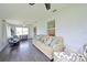 Bright sunroom features a comfy couch and large windows at 21874 Hernando Ave, Port Charlotte, FL 33952