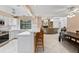 Bright, updated kitchen featuring white cabinets, stainless steel appliances, and a breakfast bar for casual dining at 4714 Elder Berry Dr, Sarasota, FL 34241