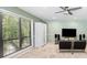 Cozy living room with a large window, modern furniture, and a ceiling fan at 4714 Elder Berry Dr, Sarasota, FL 34241